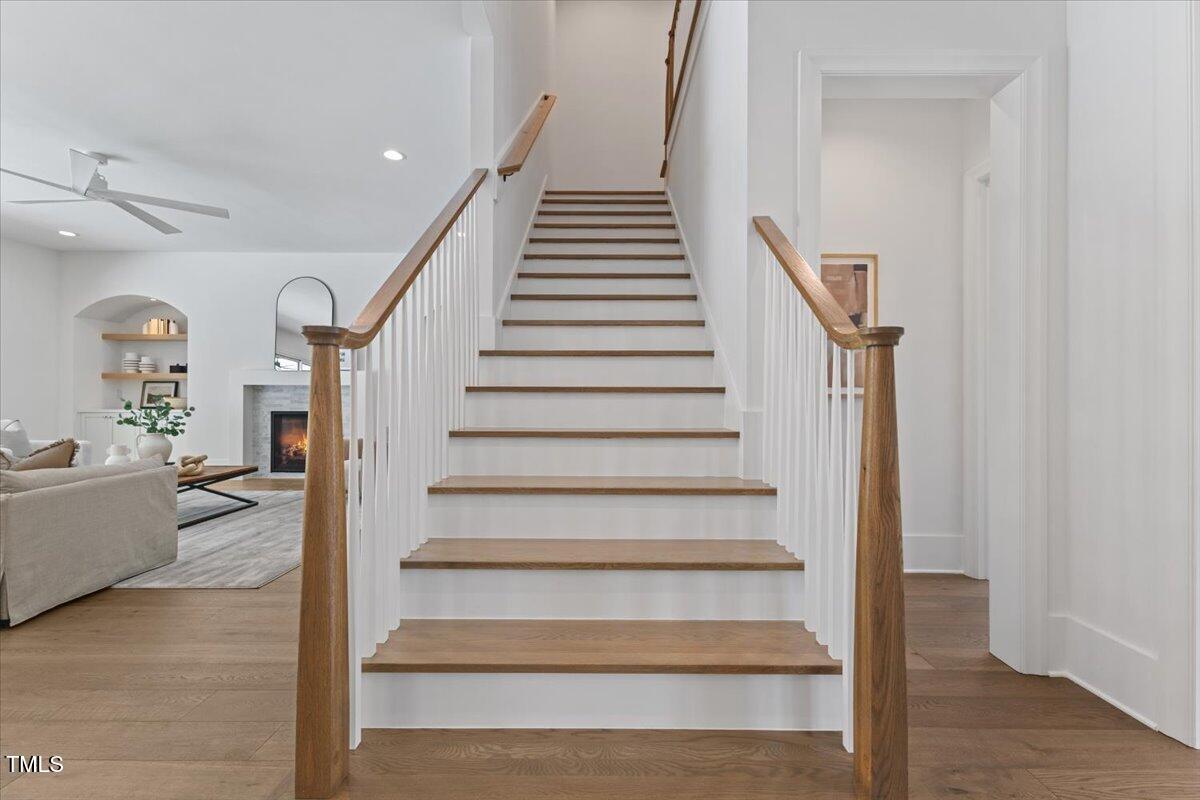 6844 Greystone Drive Raleigh, NC 27615 - Photo 46 of 83 a view of entryway and hall with wooden floor