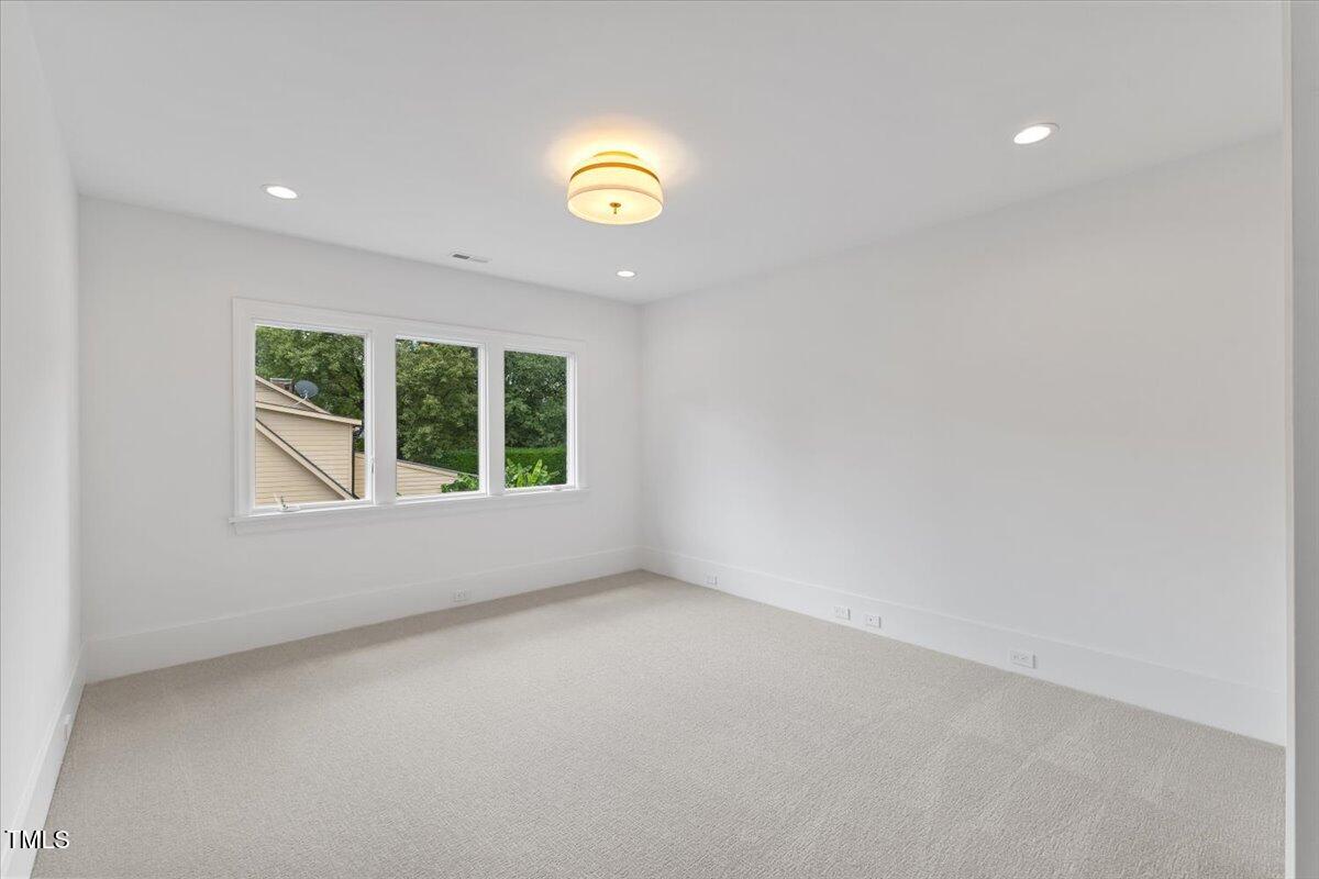 6844 Greystone Drive Raleigh, NC 27615 - Photo 62 of 83 an empty room with a window