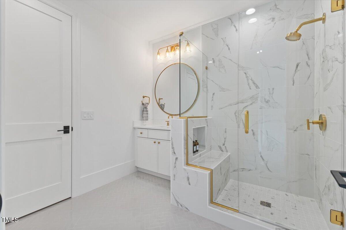 6844 Greystone Drive Raleigh, NC 27615 - Photo 64 of 83 a bathroom with a sink a toilet and shower