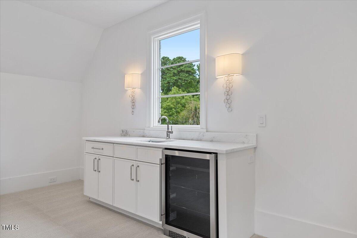6844 Greystone Drive Raleigh, NC 27615 - Photo 68 of 83 a bathroom with a sink and a window