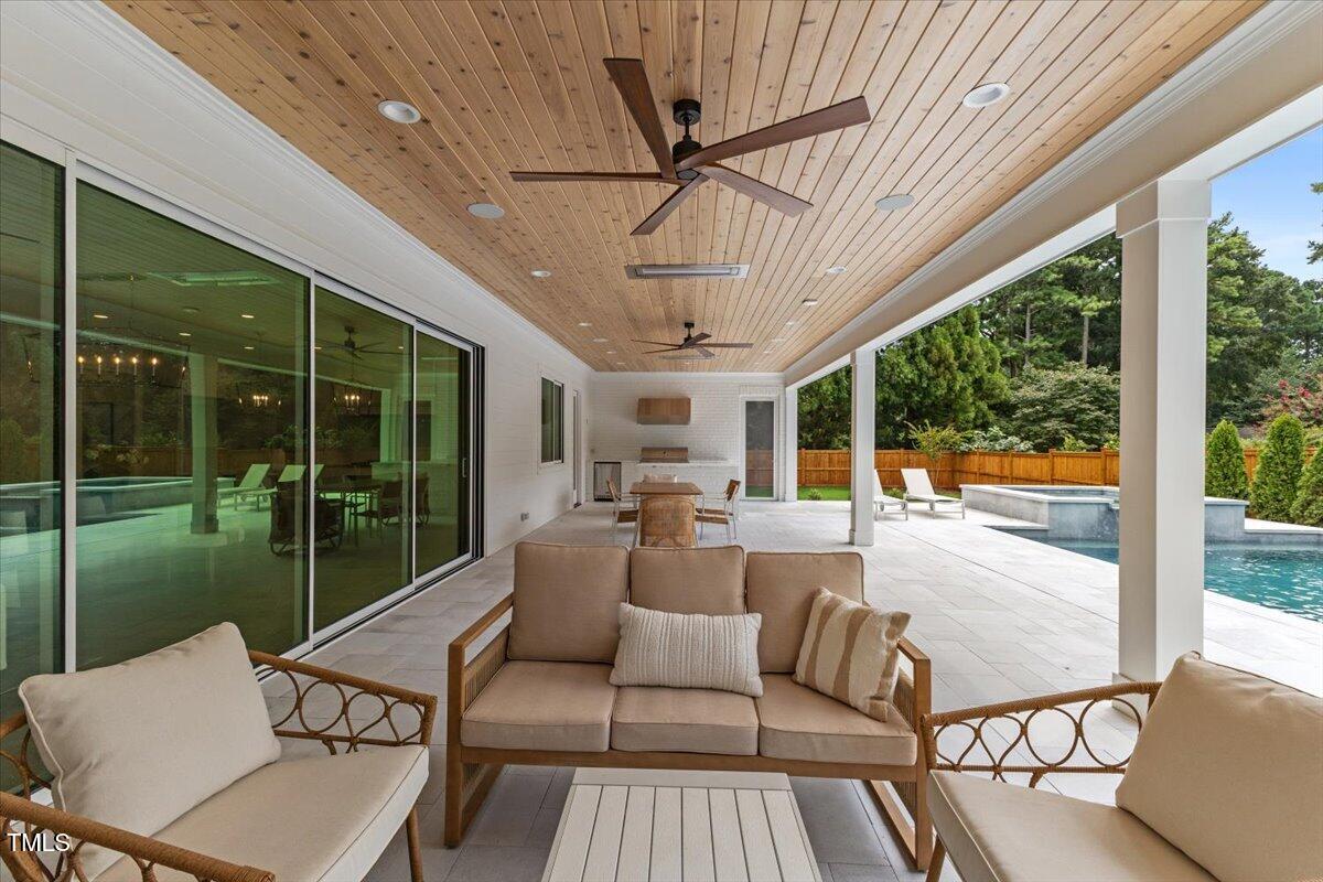 6844 Greystone Drive Raleigh, NC 27615 - Photo 74 of 83 a outdoor space with patio the couches and dining table with a garden view