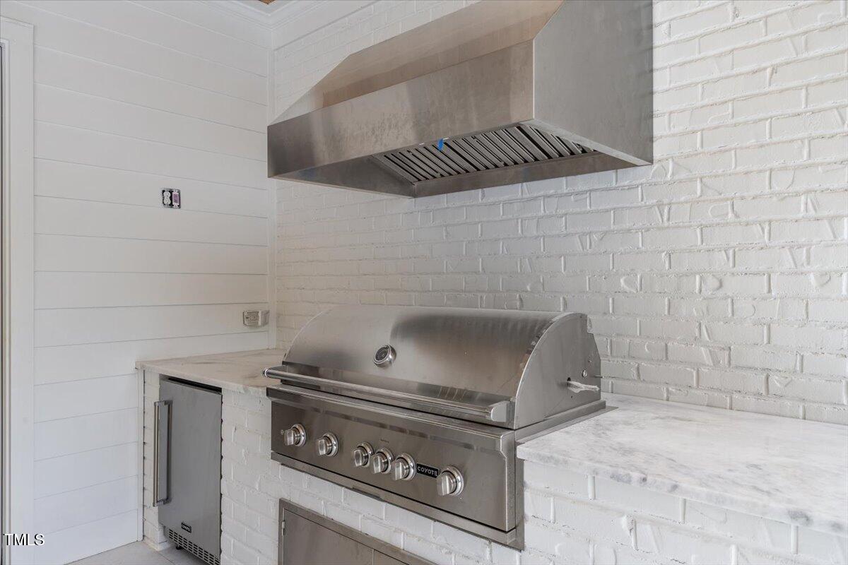6844 Greystone Drive Raleigh, NC 27615 - Photo 79 of 83 a stove top oven sitting inside of a kitchen