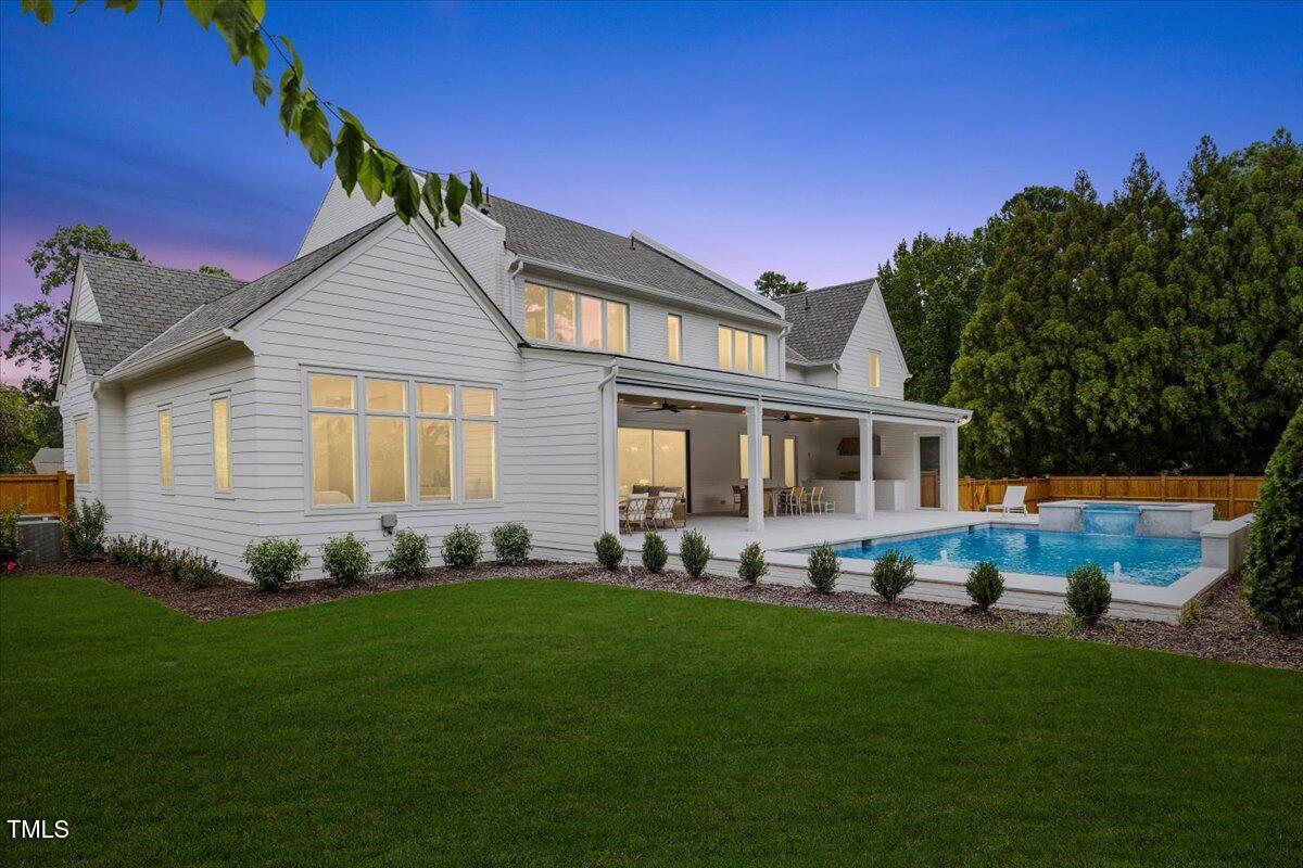 6844 Greystone Drive Raleigh, NC 27615 - Photo 83 of 83 a front view of a house with a garden and trees