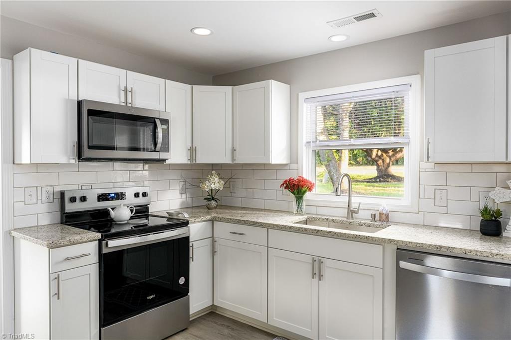 5515 Bethania Road Pfafftown, NC 27040 - Photo 14 of 49 Completely remodeled kitchen with all new cabinets, countertops & appliances that remain