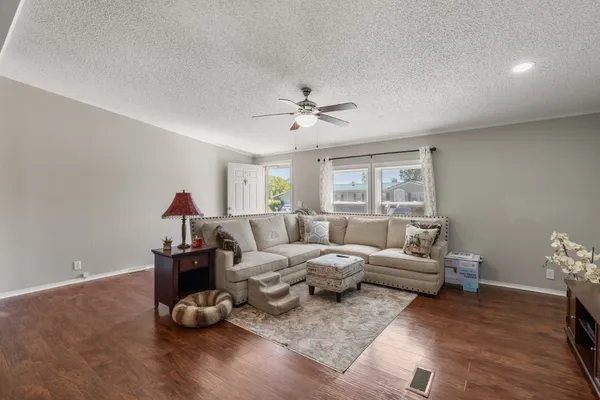 a living room with furniture and a window