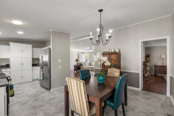 a view of a dining room and chandelier