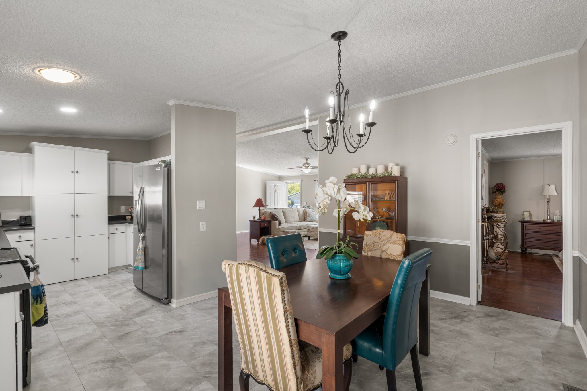 129 Broken Arrow Paris, TN 38242 - Photo 14 of 49 a view of a dining room and chandelier