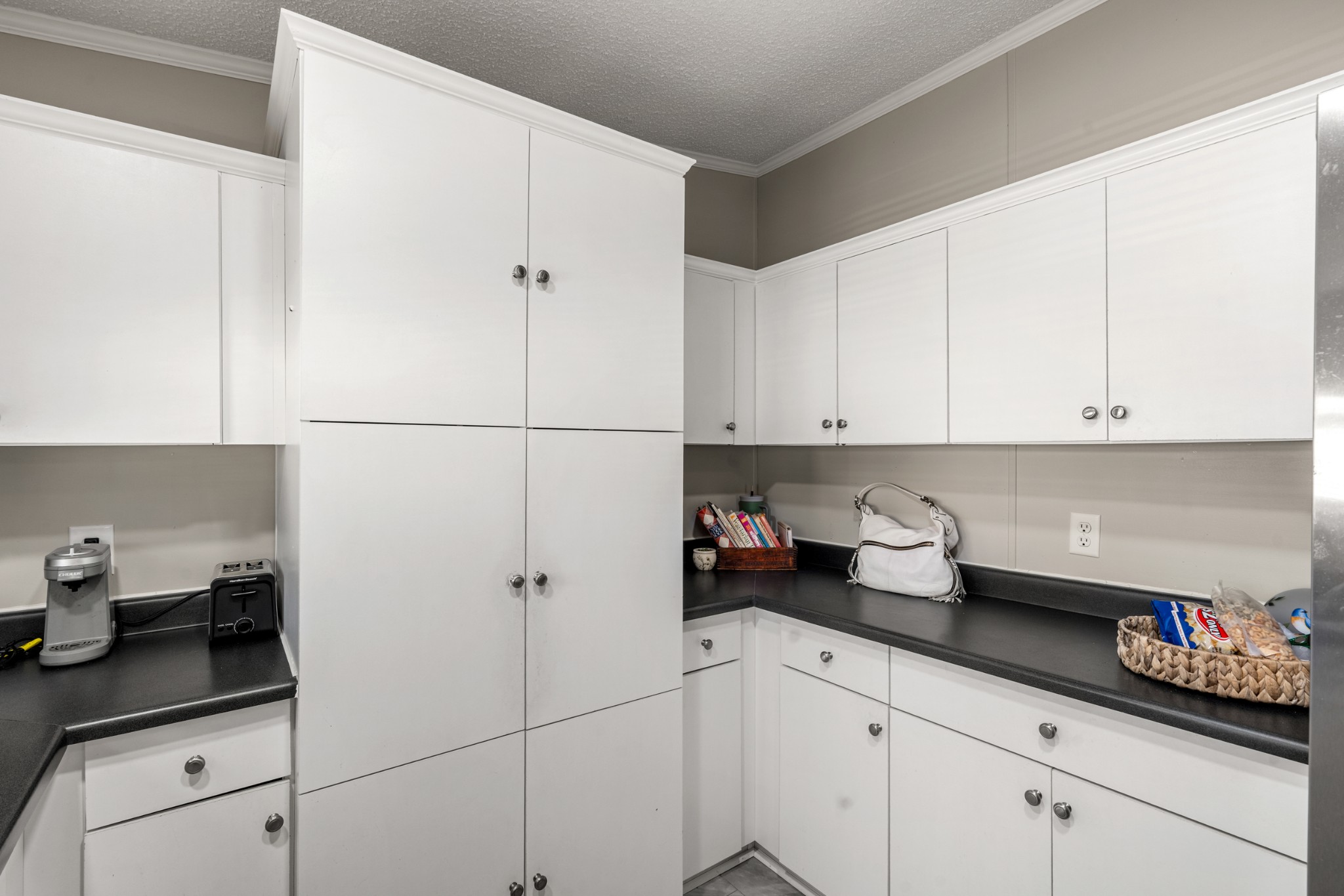 129 Broken Arrow Paris, TN 38242 - Photo 15 of 49 a kitchen with stainless steel appliances granite countertop white cabinets sink and a refrigerator