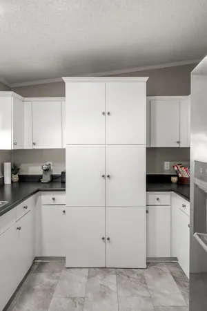 a kitchen with a sink and cabinets