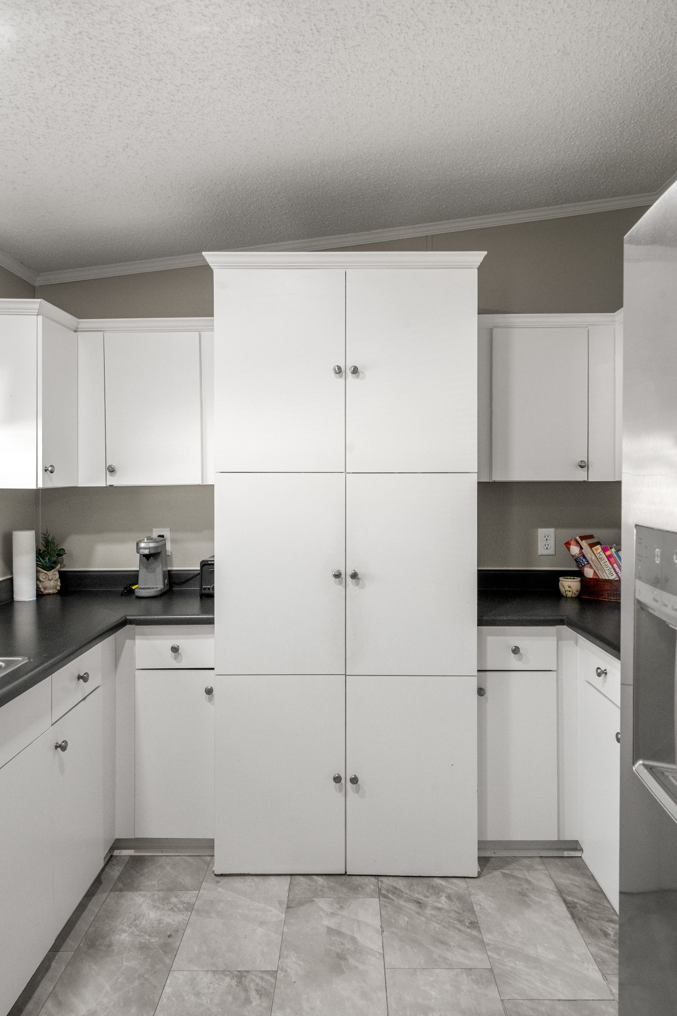129 Broken Arrow Paris, TN 38242 - Photo 16 of 49 a kitchen with a sink and cabinets