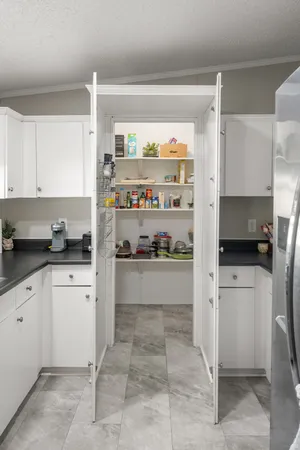 a kitchen with stainless steel appliances a refrigerator sink and cabinets