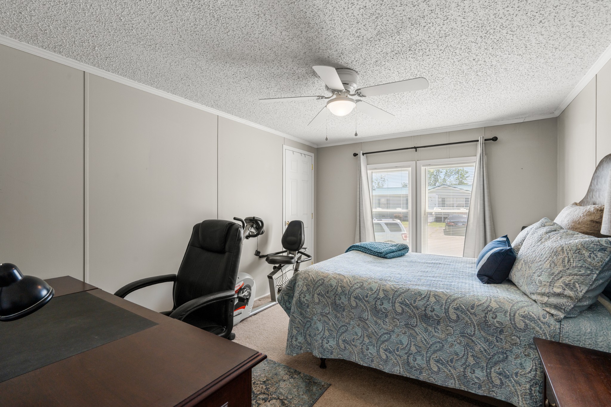 129 Broken Arrow Paris, TN 38242 - Photo 29 of 49 a bedroom with a bed a desk and chair