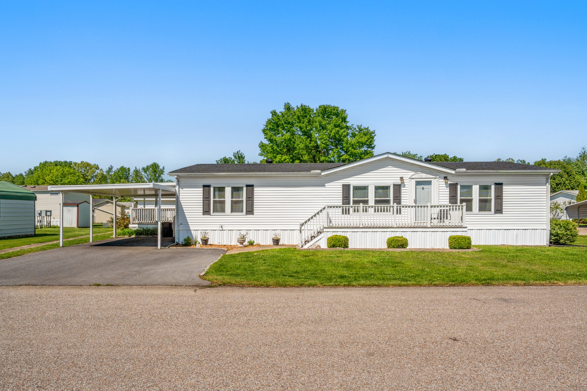129 Broken Arrow Paris, TN 38242 - Photo 3 of 49 a front view of a house with a yard
