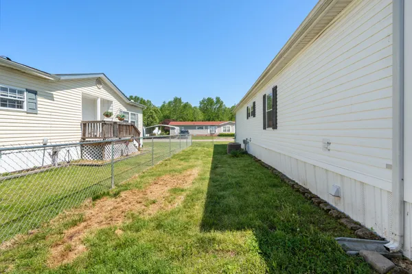 a view of a house with wooden deck