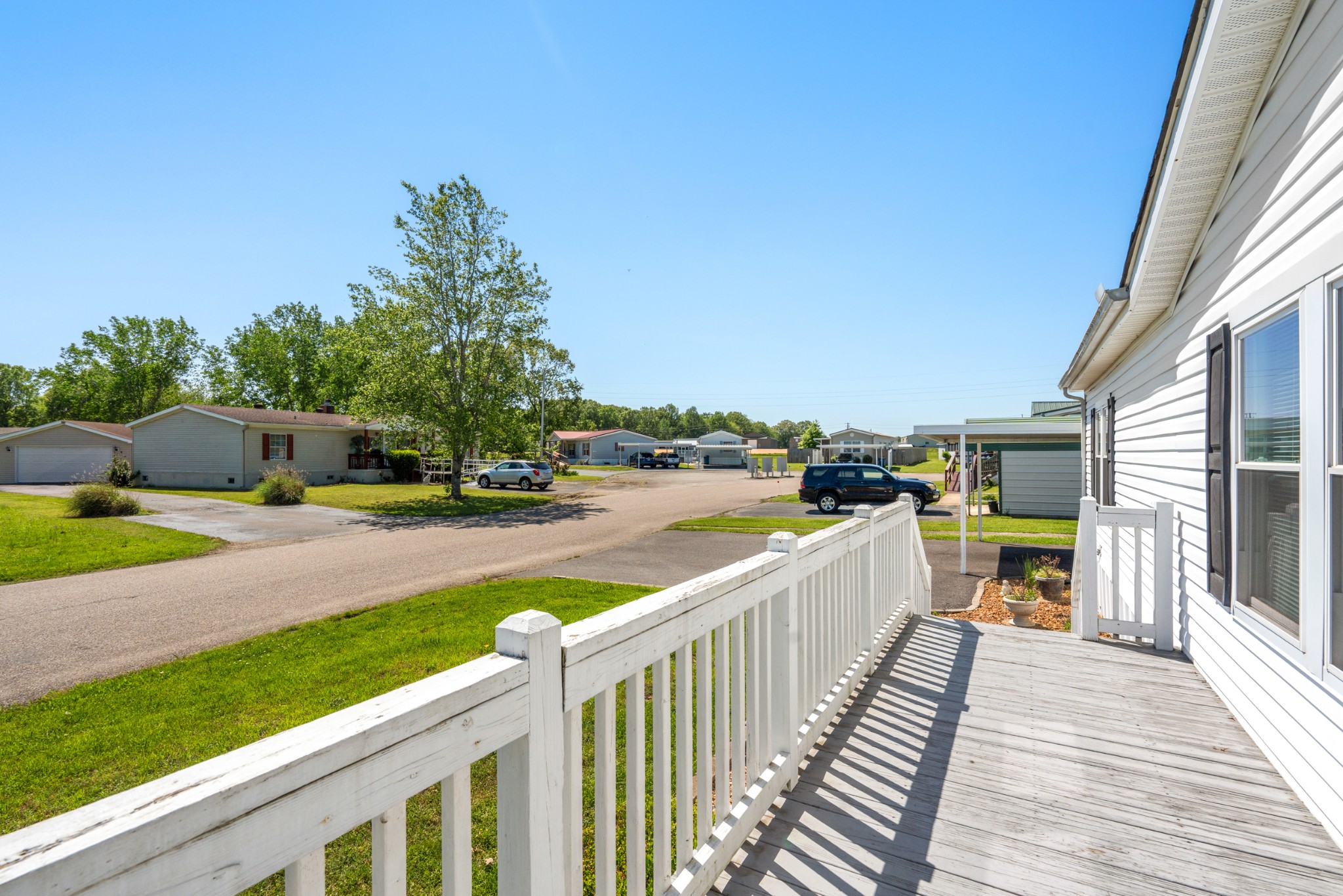 129 Broken Arrow Paris, TN 38242 - Photo 34 of 49 a view of a house with wooden deck