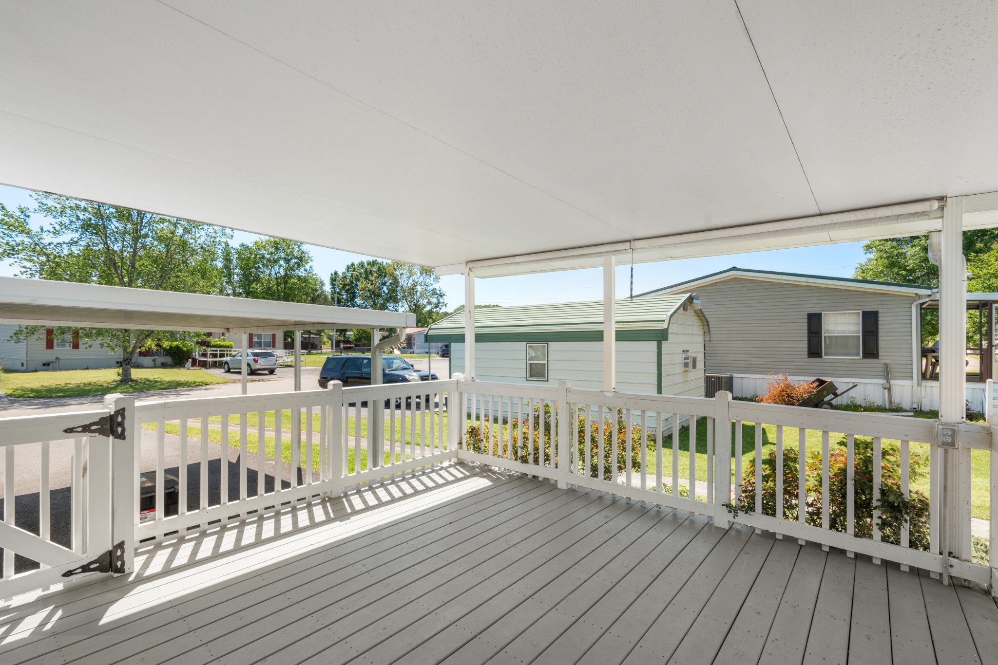 129 Broken Arrow Paris, TN 38242 - Photo 35 of 49 a view of a house with wooden deck and furniture
