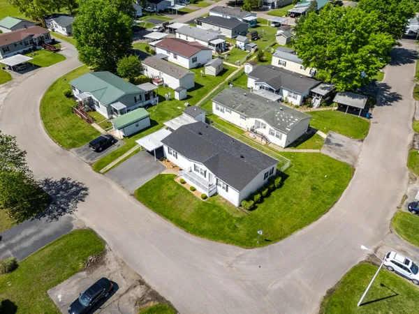 an aerial view of a house with a swimming pool