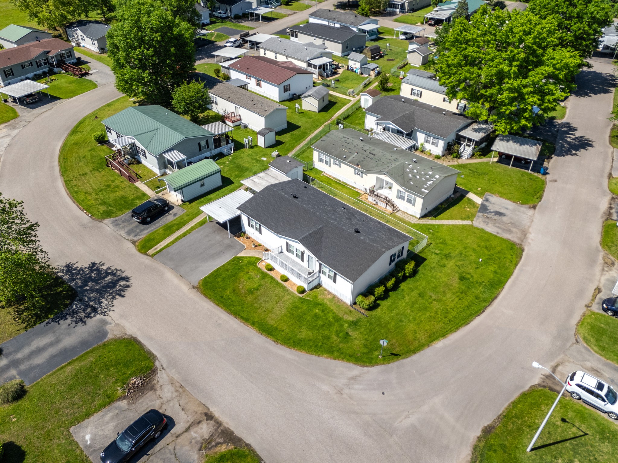 129 Broken Arrow Paris, TN 38242 - Photo 37 of 49 an aerial view of a house with a swimming pool outdoor seating and outdoor seating