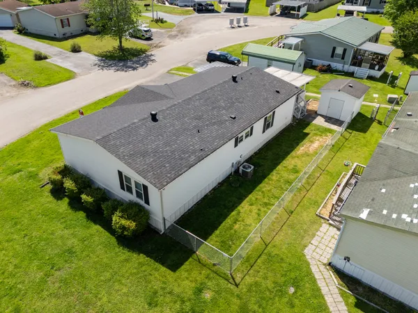 an aerial view of a house with a swimming pool
