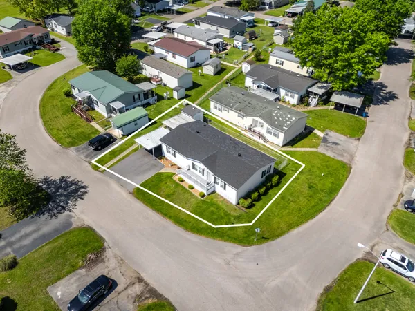 an aerial view of a houses with outdoor space