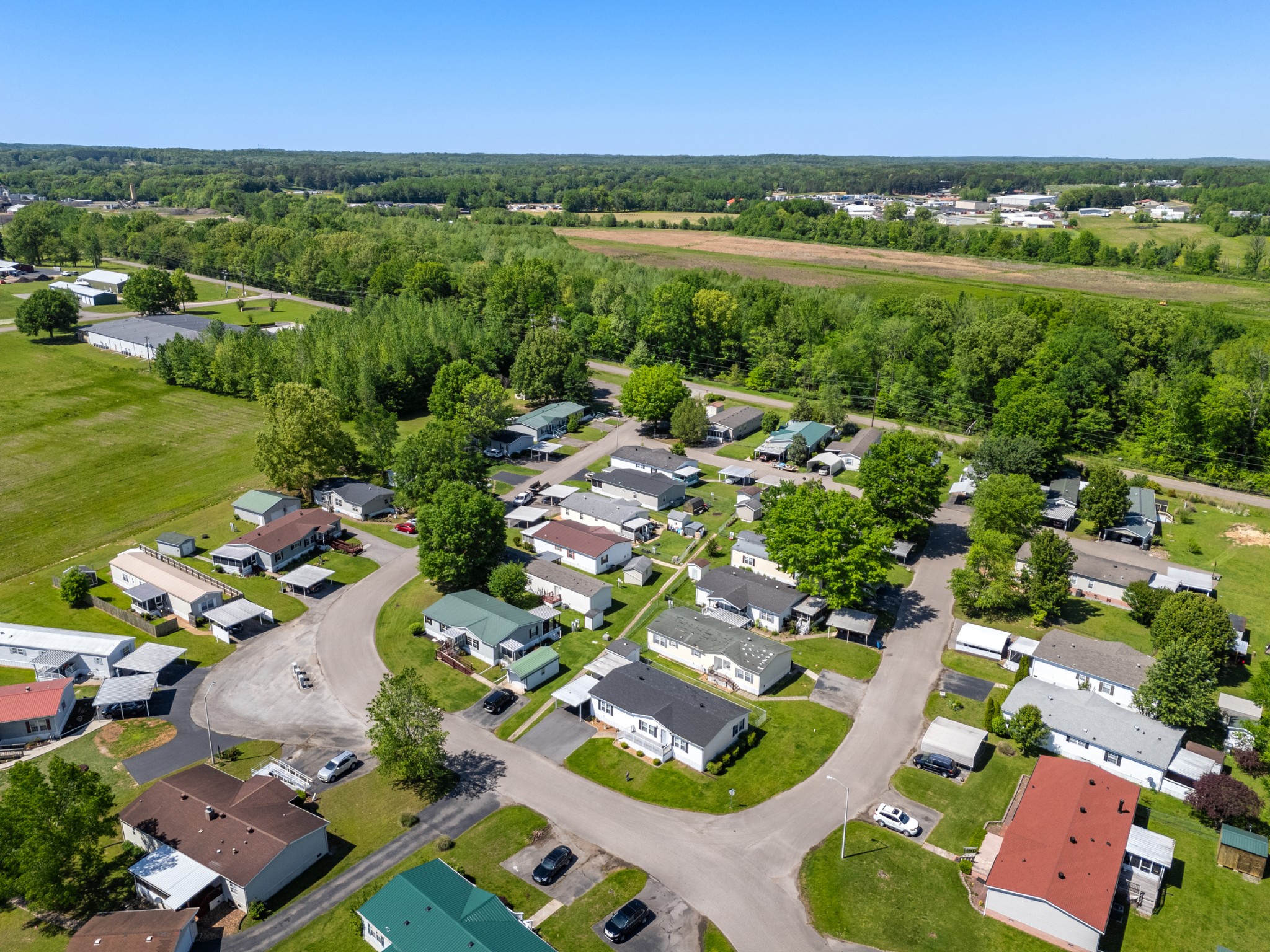 129 Broken Arrow Paris, TN 38242 - Photo 48 of 49 an aerial view of residential houses with outdoor space and river