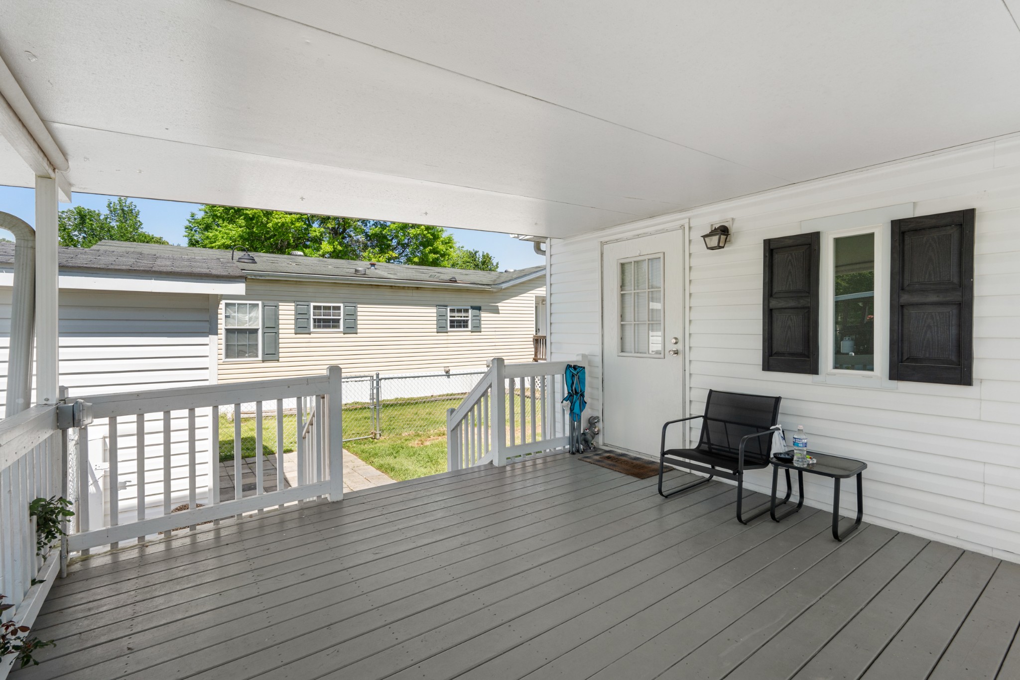 129 Broken Arrow Paris, TN 38242 - Photo 5 of 49 a porch with seating space and hardwood floor