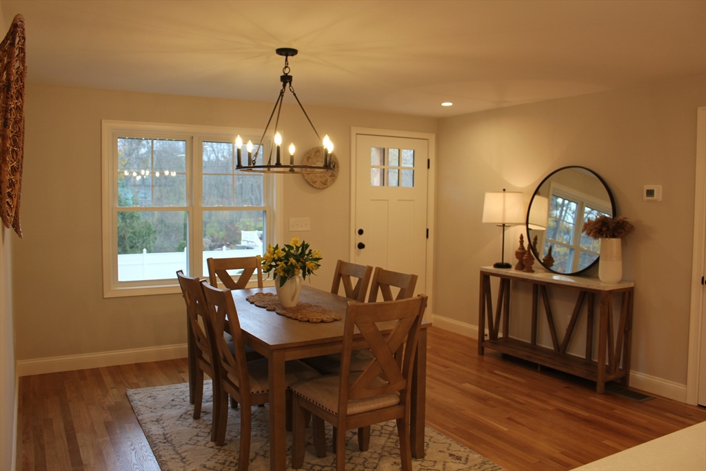 30 Maple Street Hudson, MA 01749 - Photo 11 of 36 a view of a dining room with furniture window and wooden floor