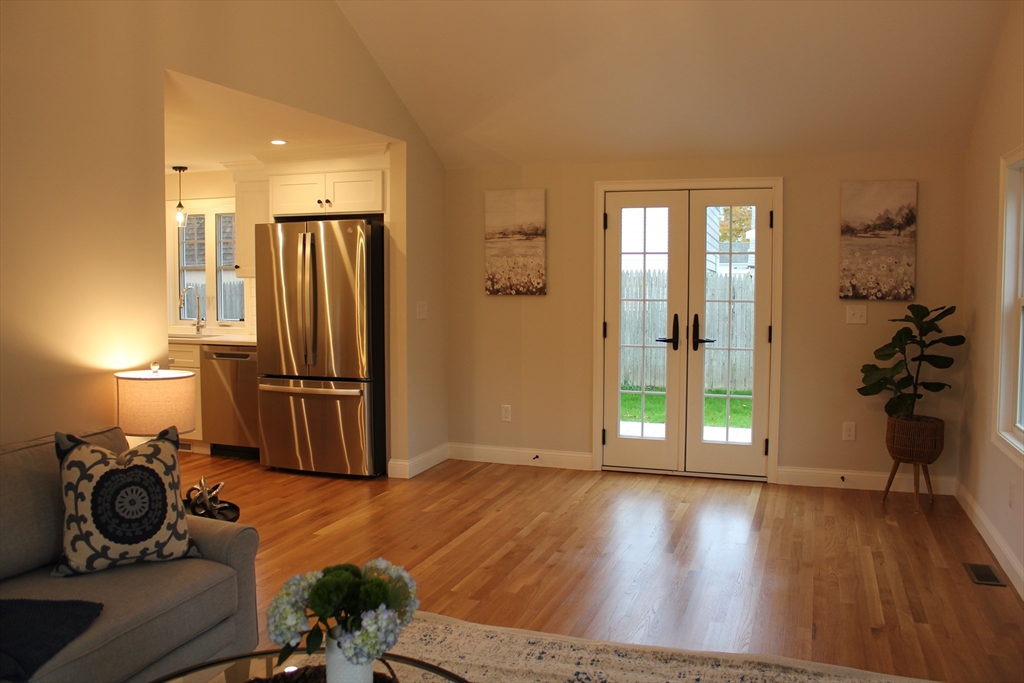 30 Maple Street Hudson, MA 01749 - Photo 14 of 36 a view of a livingroom with furniture and a ceiling fan