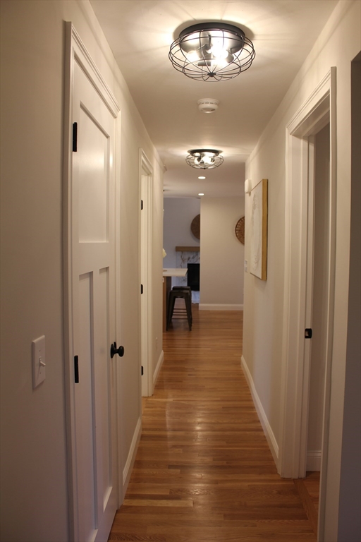 30 Maple Street Hudson, MA 01749 - Photo 19 of 36 a view of a hallway with wooden floor and staircase