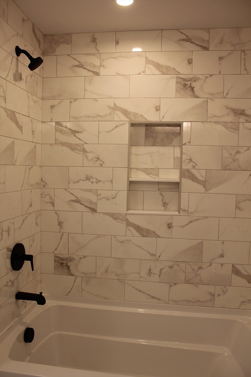 30 Maple Street Hudson, MA 01749 - Photo 23 of 36 a bathroom with a bathtub