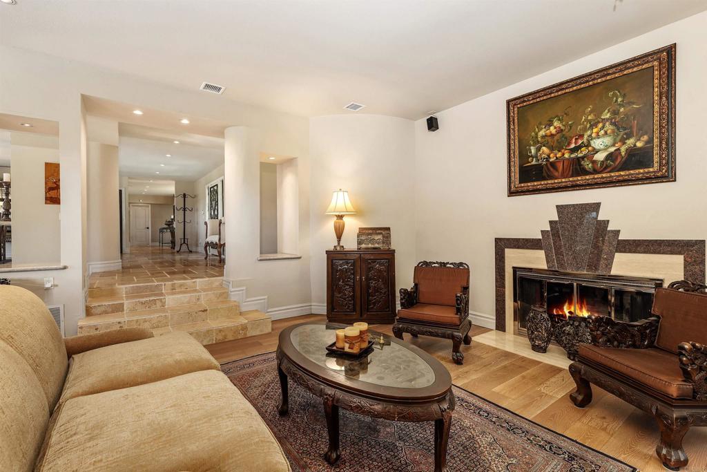 16346 Via Del Alba Rancho Santa Fe, CA 92067 - Photo 13 of 34 a living room with furniture and a fireplace