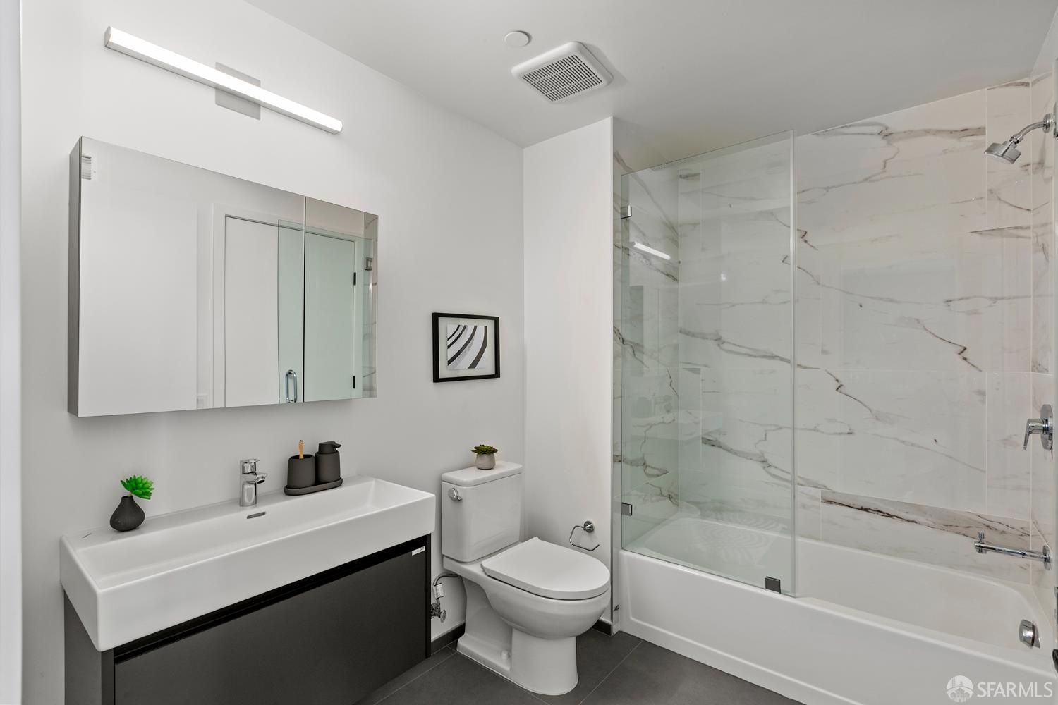 988 Harrison Street, Unit HL4 San Francisco, CA 94107 - Photo 9 of 10 a bathroom with a sink toilet and shower