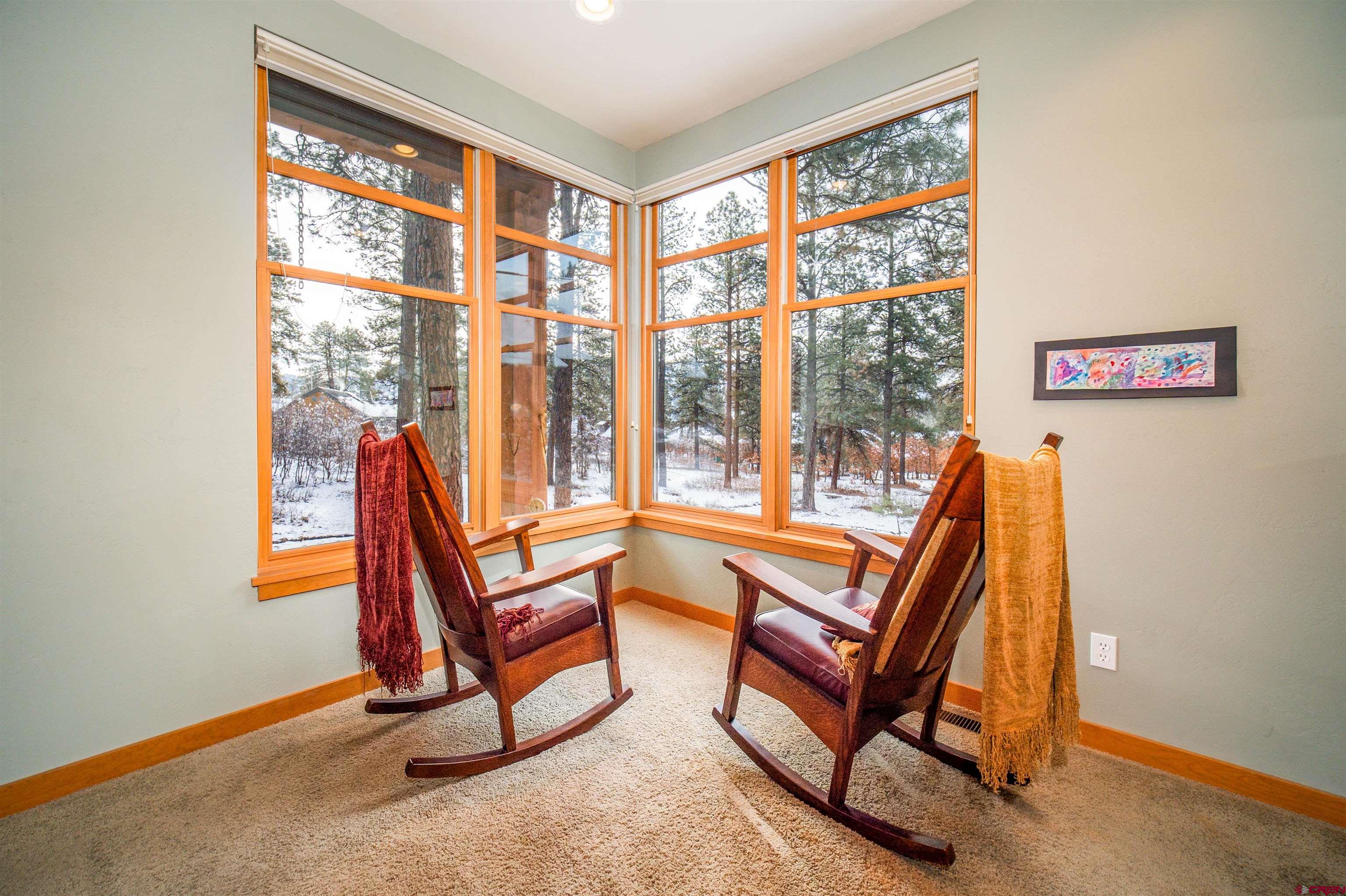25 Red Table Court Durango, CO 81301 - Photo 11 of 34 a view of a room with a window and a couch