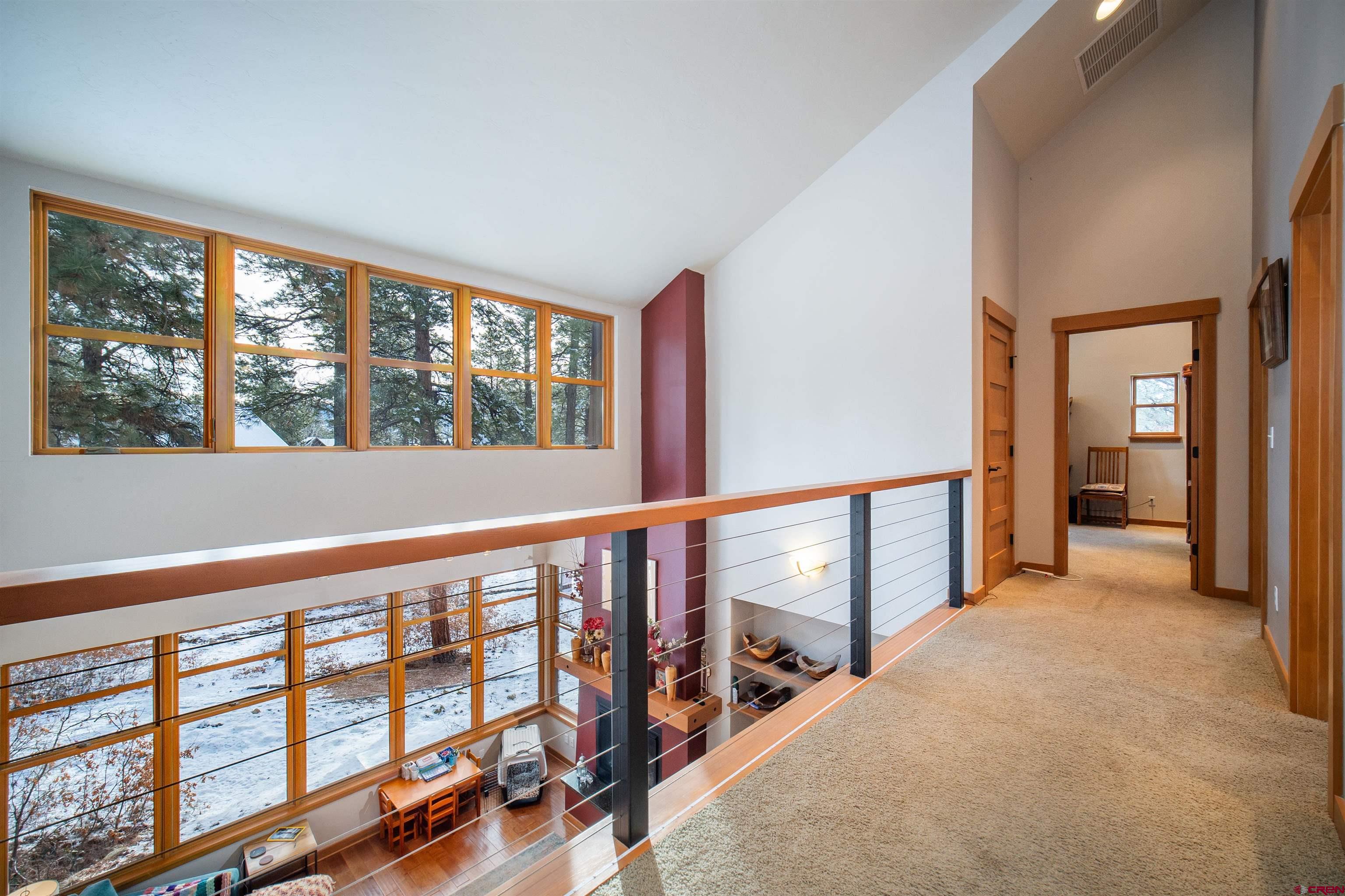 25 Red Table Court Durango, CO 81301 - Photo 16 of 34 a view of an empty room with wooden floor and a window