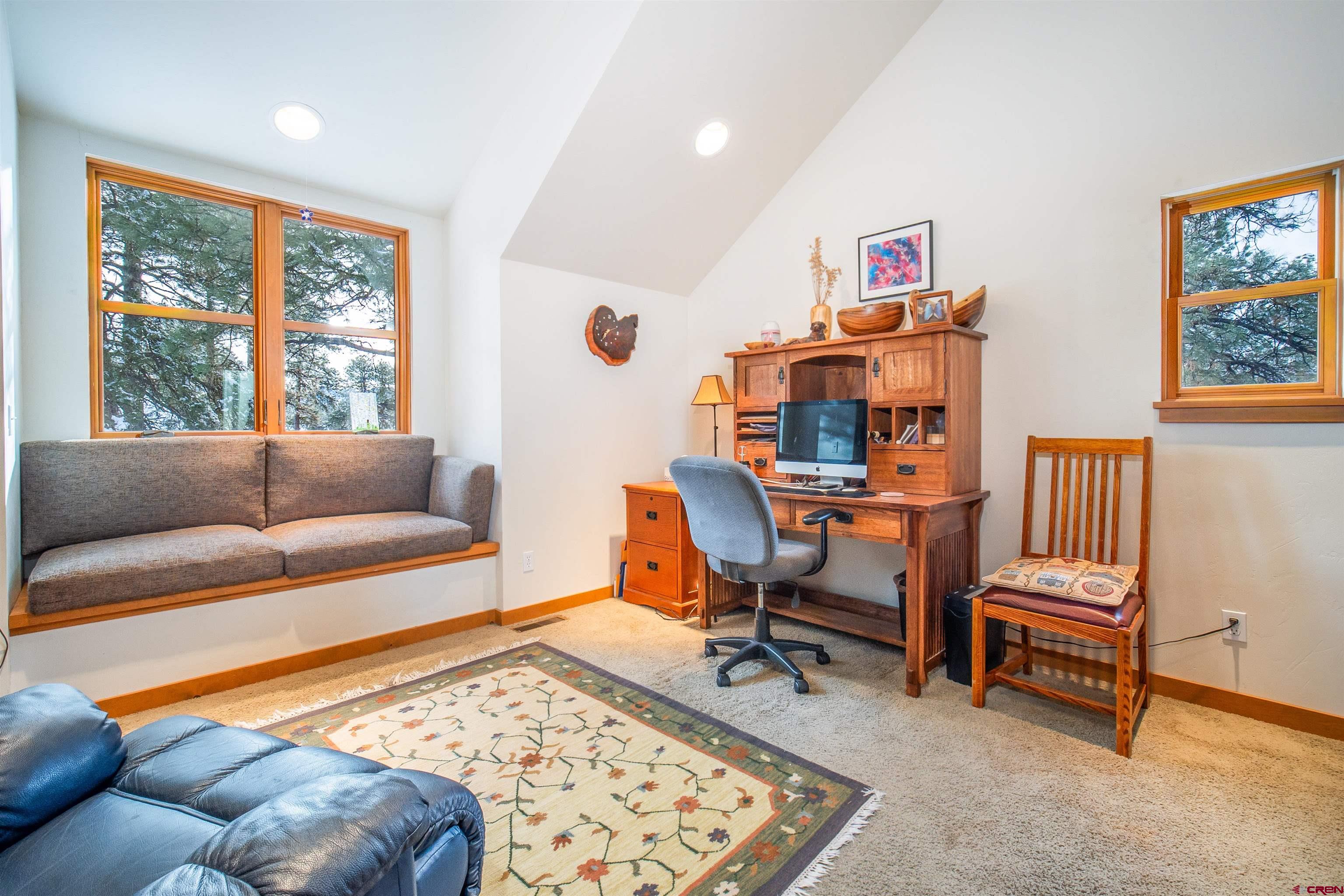25 Red Table Court Durango, CO 81301 - Photo 17 of 34 a living room with furniture and a window