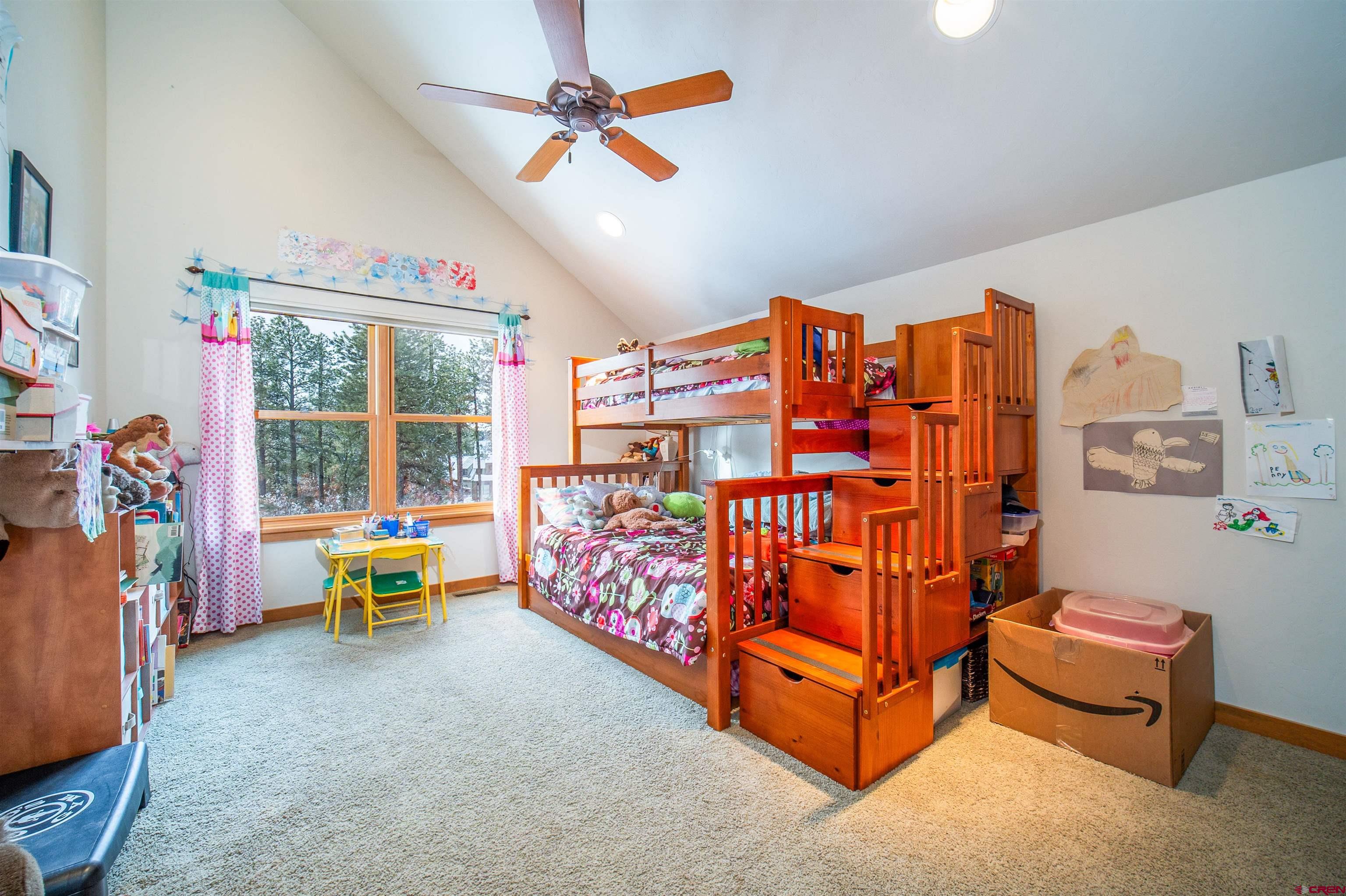25 Red Table Court Durango, CO 81301 - Photo 18 of 34 a bedroom with furniture and a large window