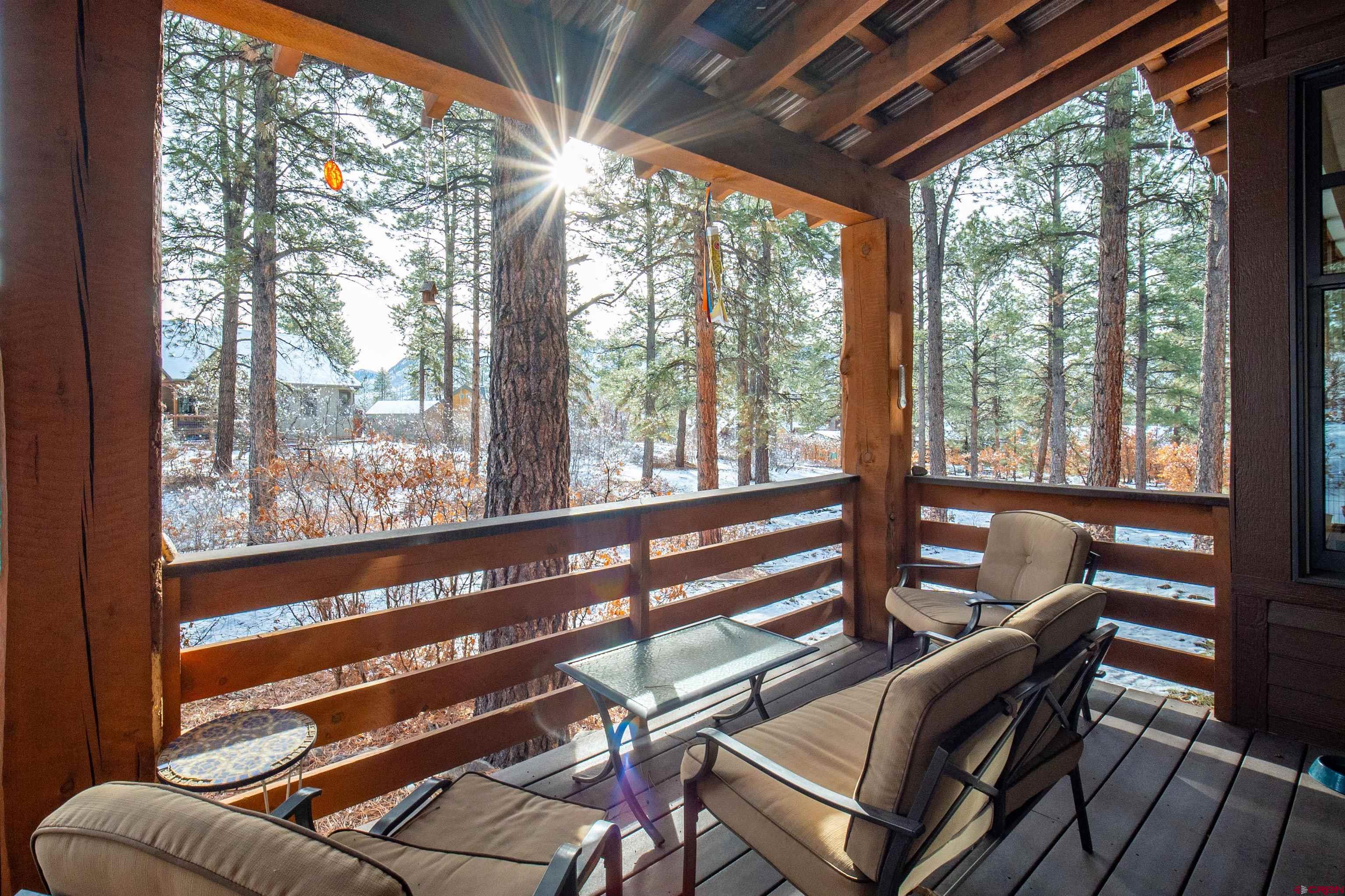 25 Red Table Court Durango, CO 81301 - Photo 24 of 34 a view of a living room with furniture and windows