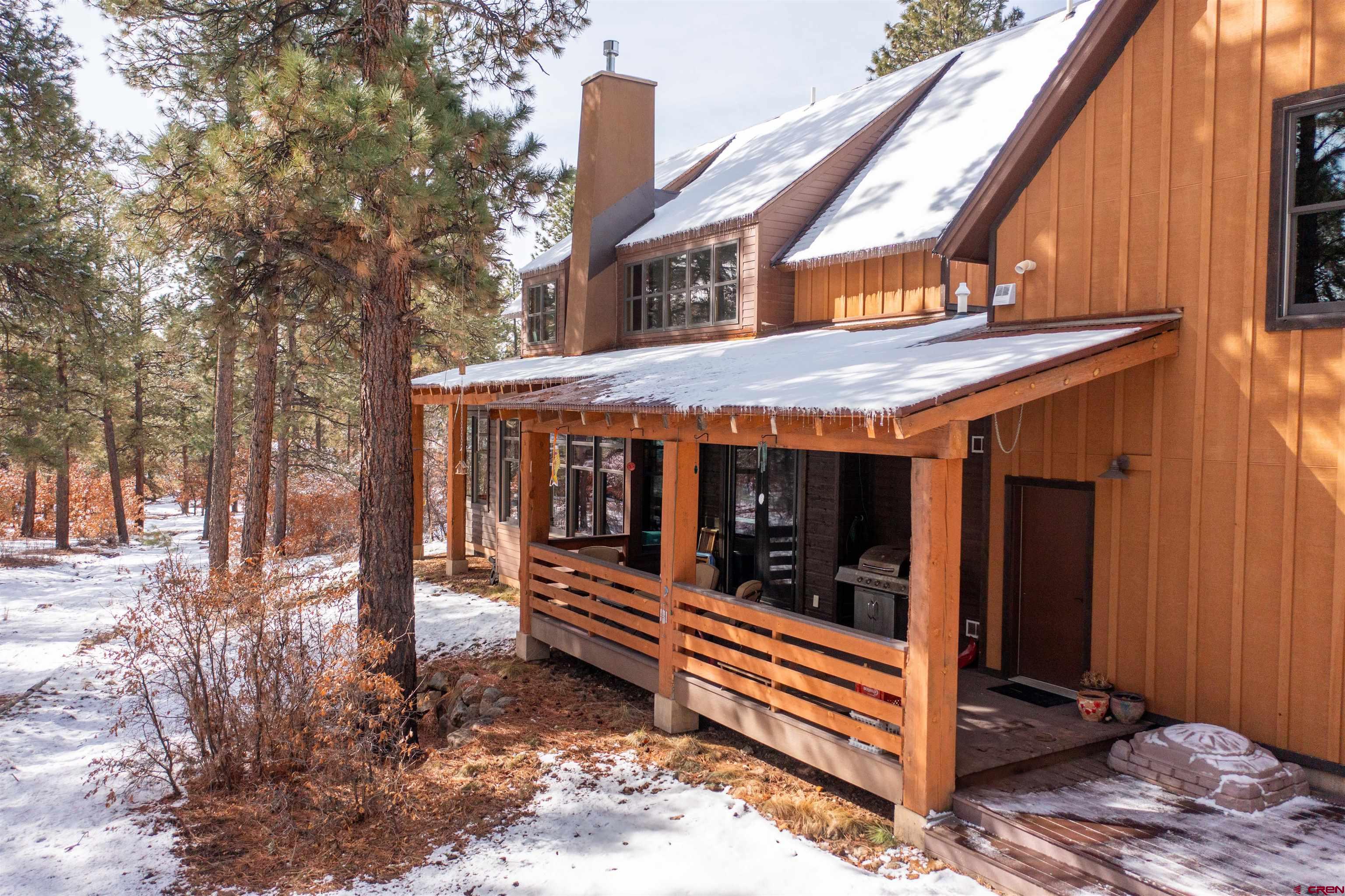 25 Red Table Court Durango, CO 81301 - Photo 29 of 34 a view of a house with a yard and wooden fence