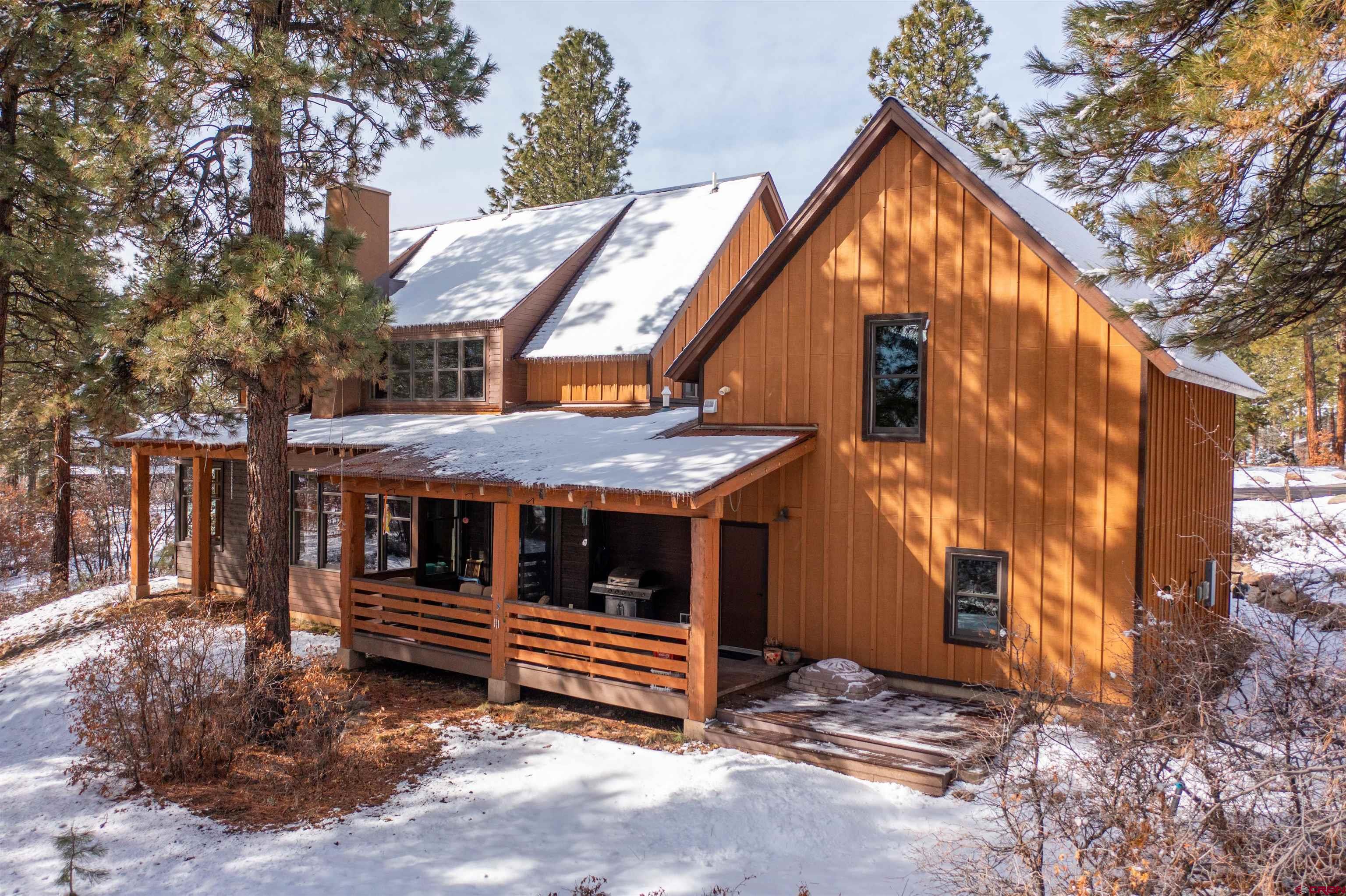 25 Red Table Court Durango, CO 81301 - Photo 31 of 34 a backyard of a house with barbeque oven and trees