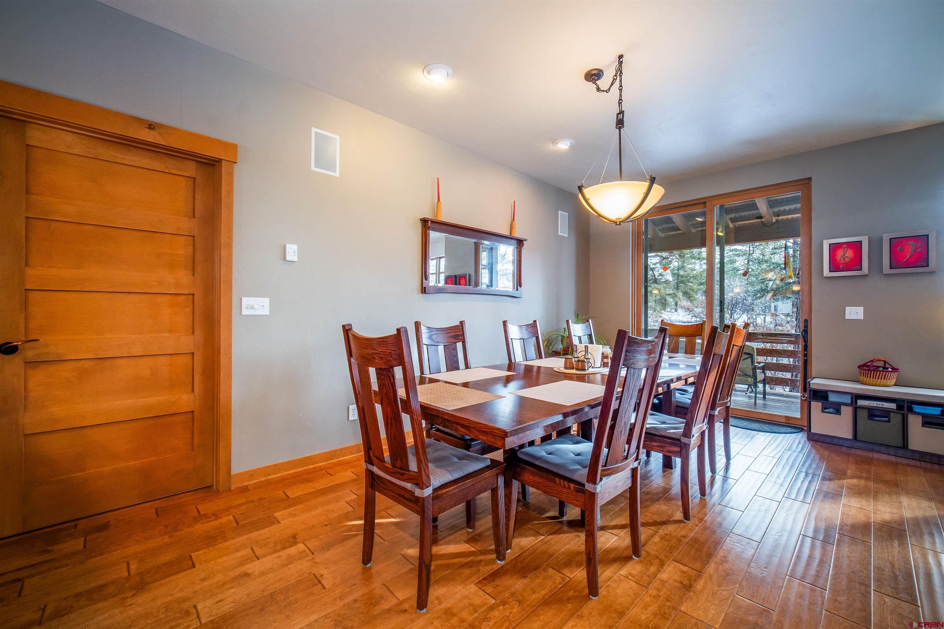 25 Red Table Court Durango, CO 81301 - Photo 6 of 34 a view of a dining room with furniture window and wooden floor