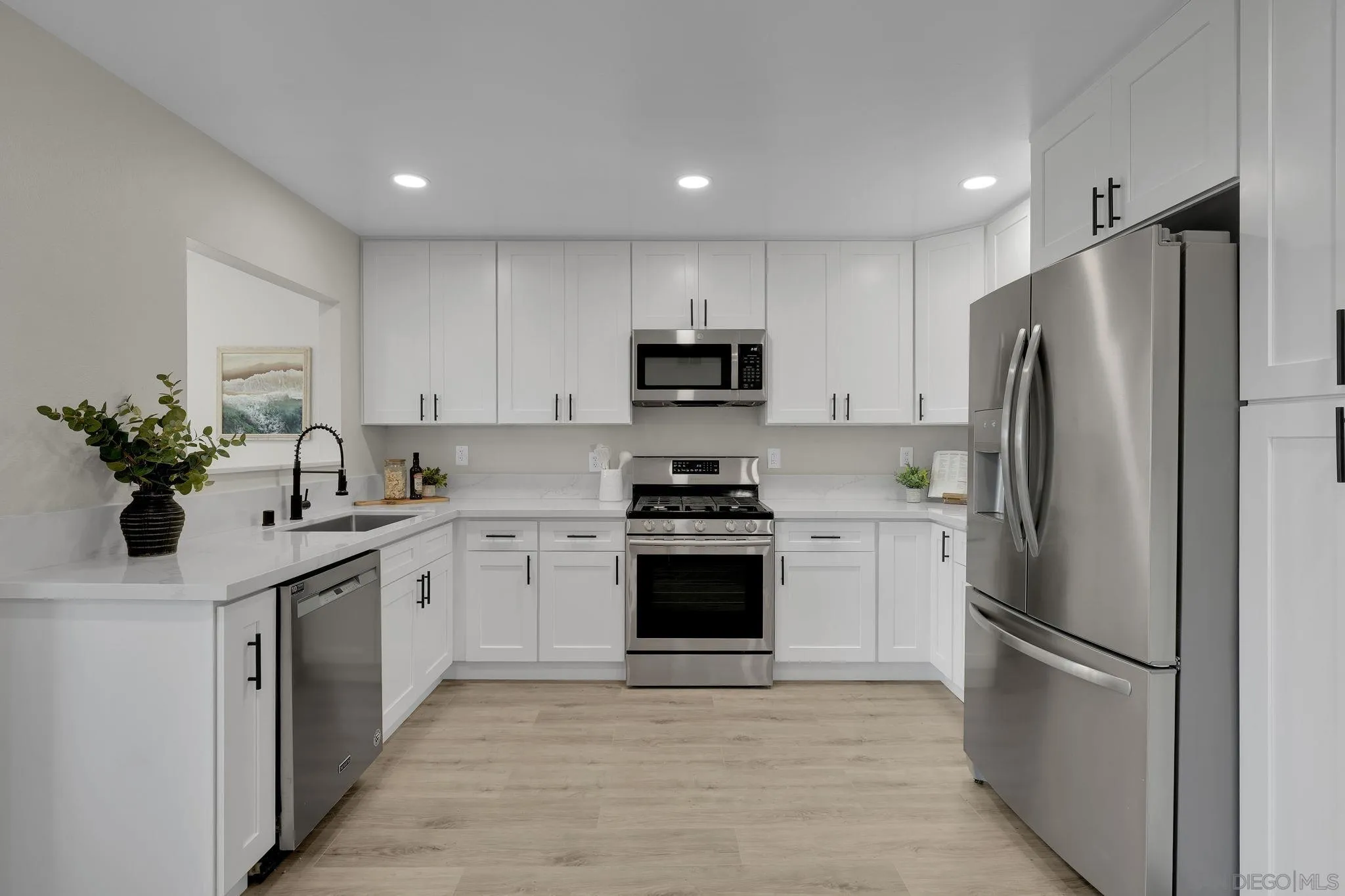 13322 Via Mark Poway, CA 92064 - Photo 6 of 25 a kitchen with stainless steel appliances granite countertop a refrigerator sink and stove