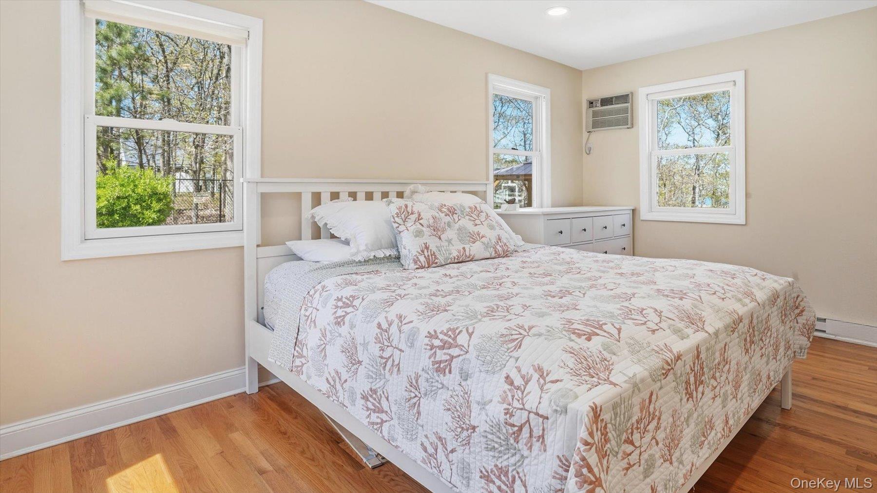 32 Red Creek Road Hampton Bays, NY 11946 - Photo 14 of 20 a bedroom with a bed and a window