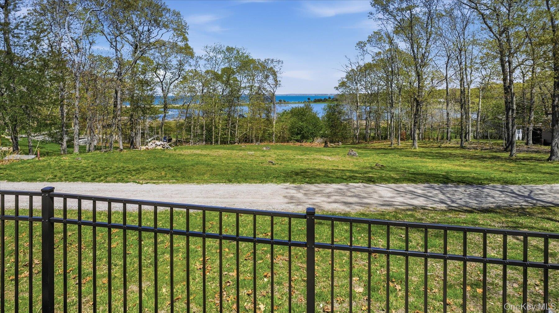 32 Red Creek Road Hampton Bays, NY 11946 - Photo 2 of 20 a view of a wooden fence