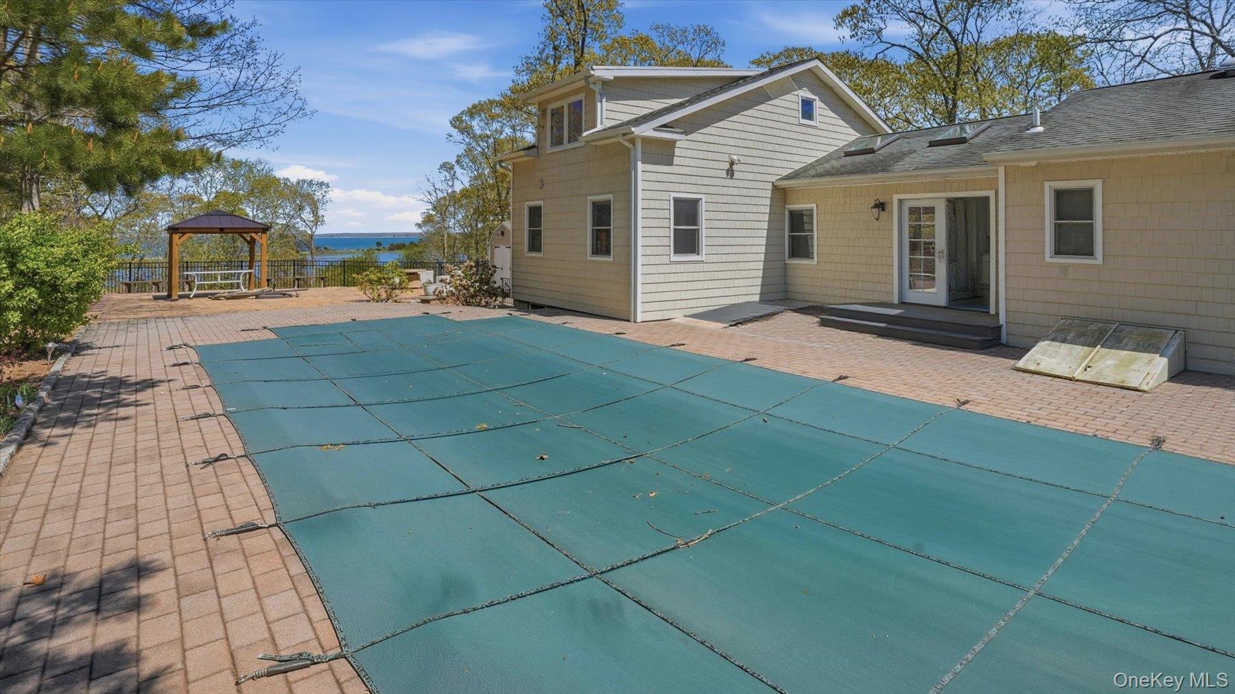 32 Red Creek Road Hampton Bays, NY 11946 - Photo 3 of 20 a view of a house with a yard