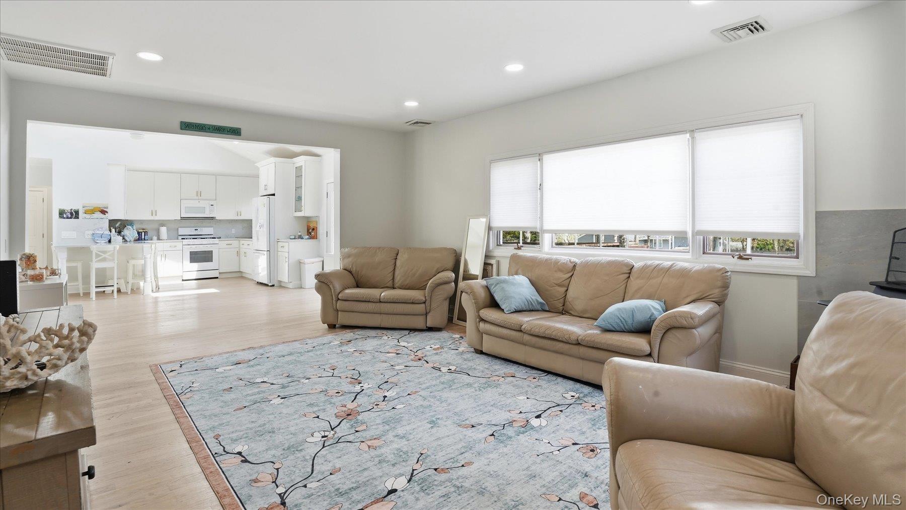 32 Red Creek Road Hampton Bays, NY 11946 - Photo 6 of 20 a living room with furniture and a large window