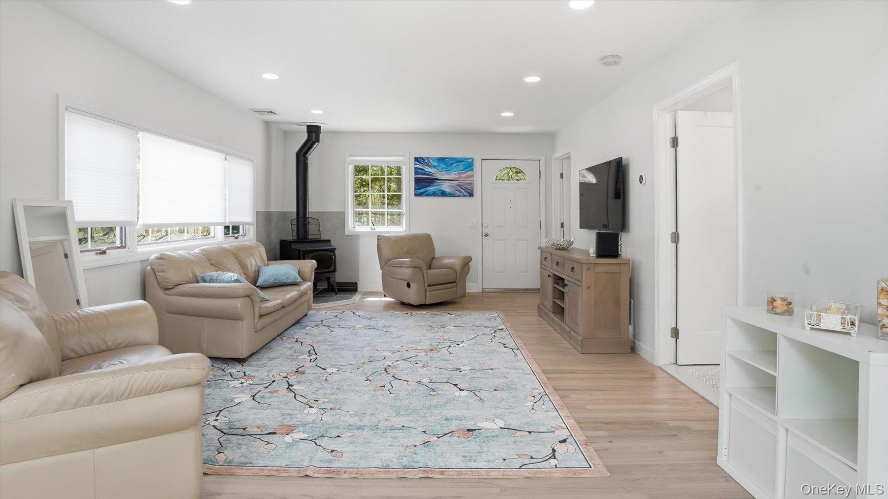 32 Red Creek Road Hampton Bays, NY 11946 - Photo 7 of 20 a living room with furniture and a large window