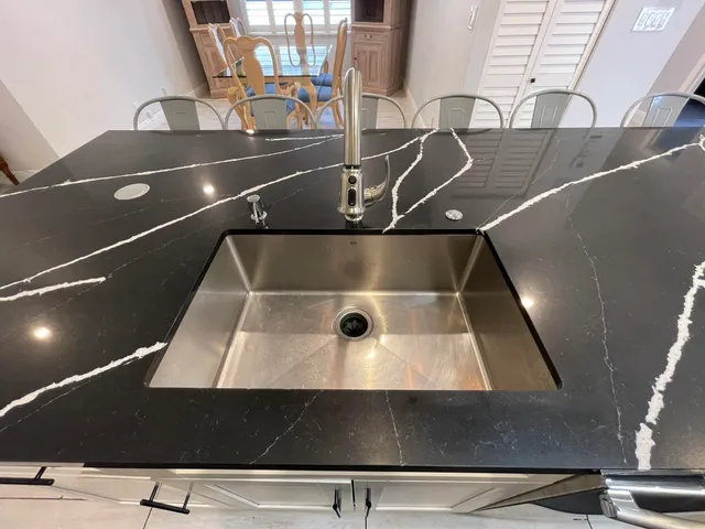 a living room with furniture and a dining table with wooden floor