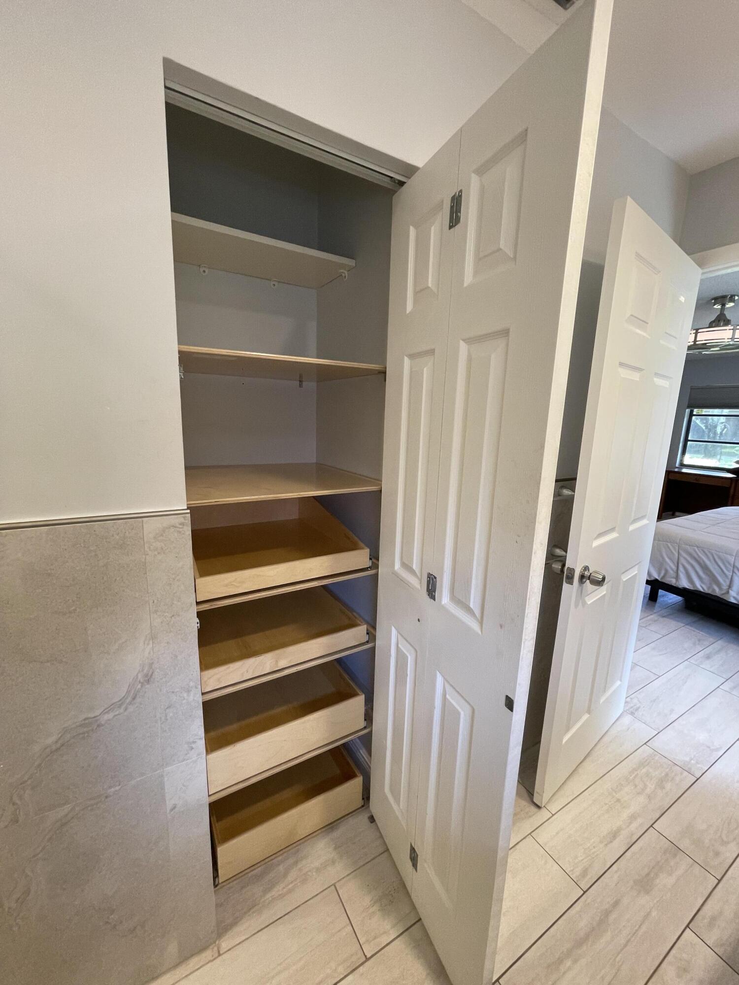6157 Sunny Pointe Circle Delray Beach, FL 33484 - Photo 19 of 64 Primary Bathroom with pull out drawers