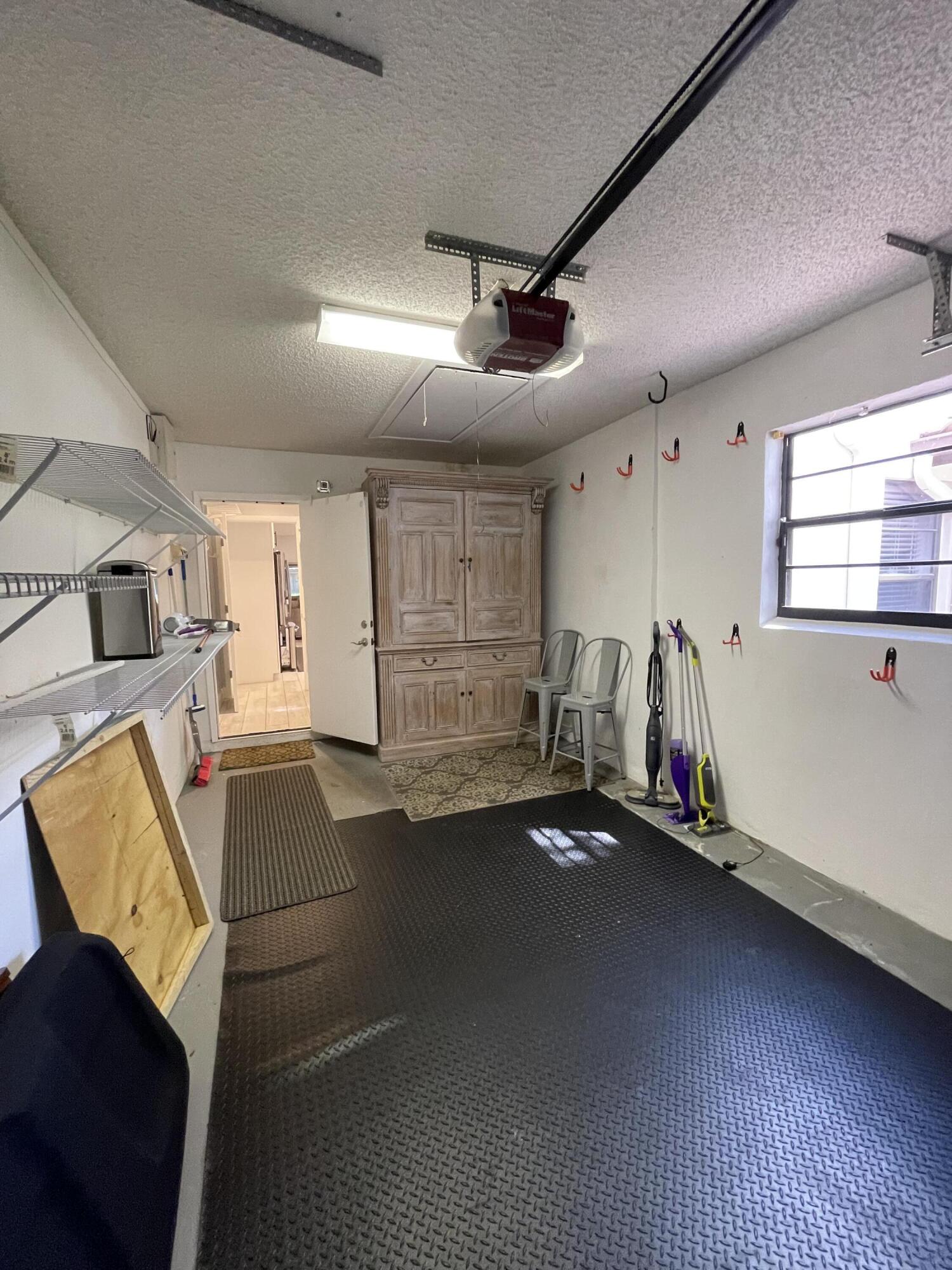 6157 Sunny Pointe Circle Delray Beach, FL 33484 - Photo 38 of 64 a view of a room with gym equipment