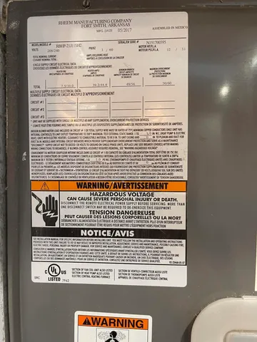 a very nice looking room with a large window and couch